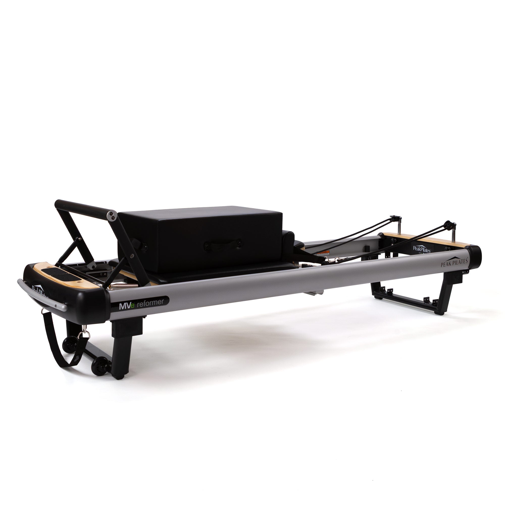 Peak Pilates MVe reformer with black upholstery and aluminum frame